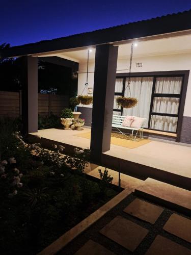 a view of a house with a patio at night at 68Warren in Vryburg