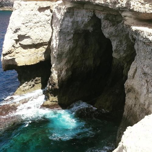 a cave in the side of a cliff at Sunshine Court in St Paul's Bay