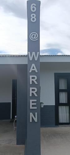a sign that says corral in front of a building at 68Warren in Vryburg