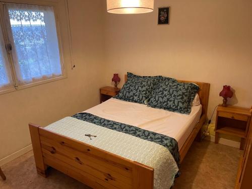 a bedroom with a bed and a window at Vue SUR VIADUC DE MILLAU in Millau