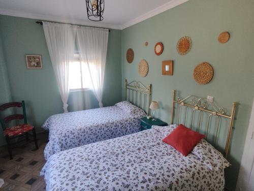 En eller flere senge i et værelse på El Andén del Hueznar