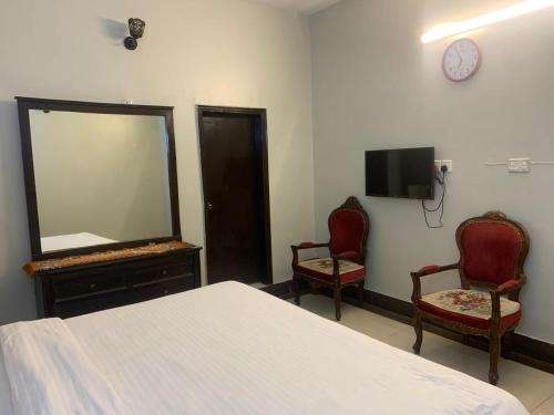 TV a/nebo společenská místnost v ubytování Karachi Rooms Nursery