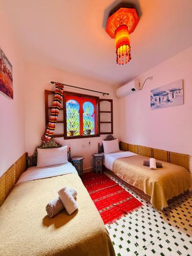 Ліжко або ліжка в номері Casa Blue Star