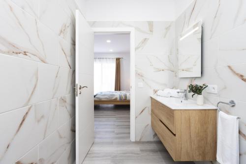 Ένα ή περισσότερα κρεβάτια σε δωμάτιο στο Casa Doña Juana - Villa de 4 dormitorios con jacuzzi y gran zona exterior