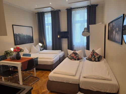 Ένα ή περισσότερα κρεβάτια σε δωμάτιο στο Wien West Home