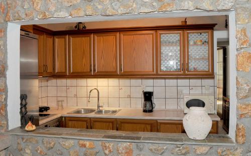 Η κουζίνα ή μικρή κουζίνα στο Giotas home near Meteora
