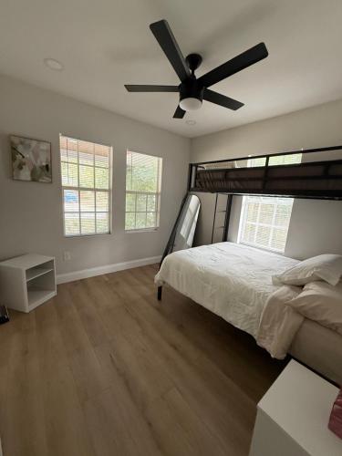 a bedroom with a bed and a ceiling fan at Casa Nova St Augustine close to Beaches, Downtown, Pier in St. Augustine