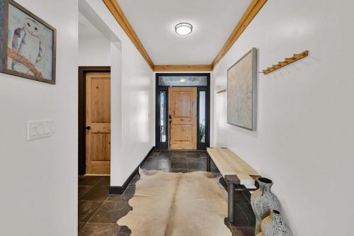 a hallway with a wooden bench in a house at Wild Horse Meadows Eden Powder Mtn in Wolf Star