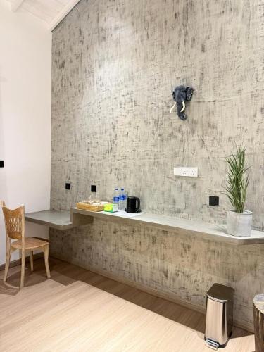 a dog sitting on a counter in a room at The Lavish Haven in Piyadigama