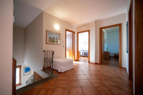 a hallway with a room with a staircase and a room with a window at Villino Blu 12 pax villa in Tuscany with private pool in Loro Ciuffenna