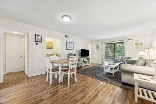 a living room with a couch and a table at 3C Amelia Landings Condo in Fernandina Beach