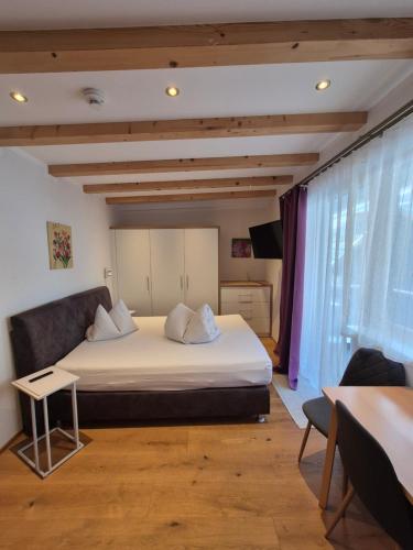 a bedroom with a large bed in a room at Apart Lenz in Ischgl