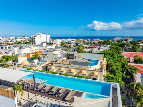 a view of the city from the roof of a building at Papaya 15 Apartments in Playa del Carmen