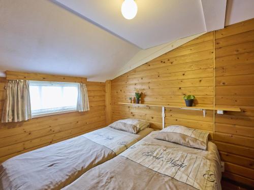 En eller flere senge i et værelse på De Vrije Vogel