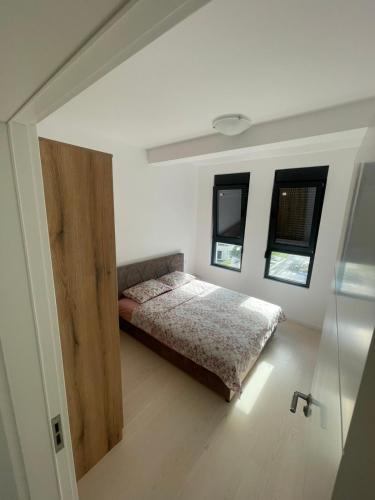 Postel nebo postele na pokoji v ubytování Triumph residence Bar