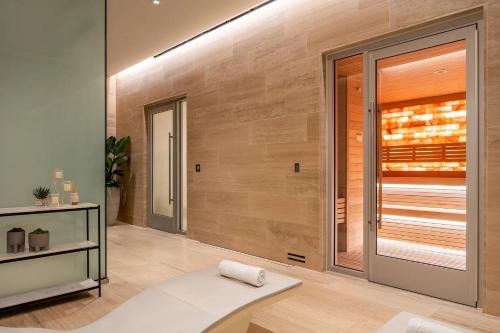 a living room with a large sliding glass door at The Pearl Coast - Rooftop Pool, Gym Luxurious 2BR Santa Monica in Los Angeles