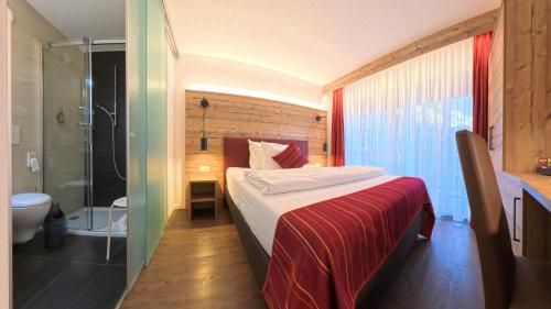 Giường trong phòng chung tại Therme 51° Hotel Physio & Spa