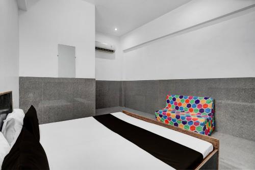 Ένα ή περισσότερα κρεβάτια σε δωμάτιο στο Hotel O Dream Guest House