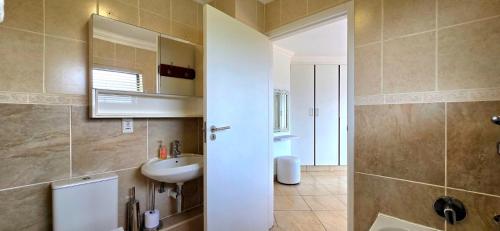 Koupelna v ubytování Under The Boardwalk