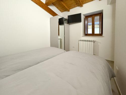 Ένα ή περισσότερα κρεβάτια σε δωμάτιο στο GM Apartments