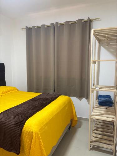 Ένα ή περισσότερα κρεβάτια σε δωμάτιο στο CASA DE 4 QUARTOS com piscina px a praia do aracagy 16 pessoas