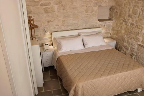 En eller flere senge i et værelse på Campanile Inn