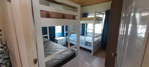 Ένα ή περισσότερα κρεβάτια σε δωμάτιο στο Tu casa de playa, Menus del Mar, te espera pronto