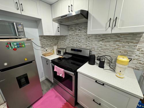 Nhà bếp/bếp nhỏ tại Appartement Cool à Longueuil Plan A