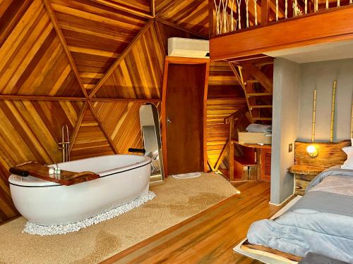 Ένα ή περισσότερα κρεβάτια σε δωμάτιο στο Vila Rosa Lodges