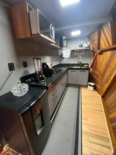 Η κουζίνα ή μικρή κουζίνα στο Vila Rosa Lodges