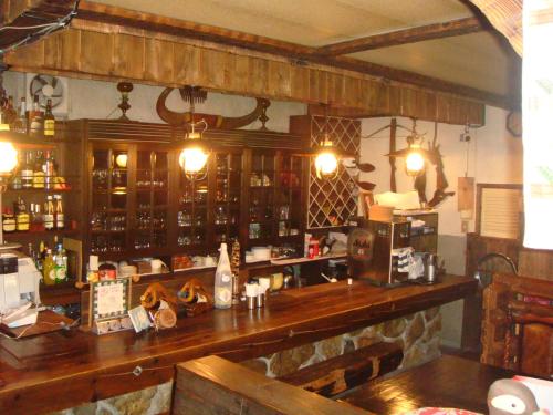 a bar in a restaurant with a counter top at Hunter Lodge in Myoko