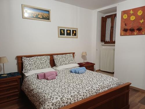 a bedroom with a bed with two pillows on it at La Dimora di Pietra in Gubbio