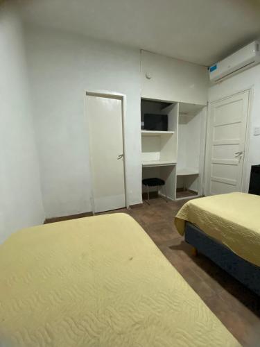 Ένα ή περισσότερα κρεβάτια σε δωμάτιο στο Hotel Báltico