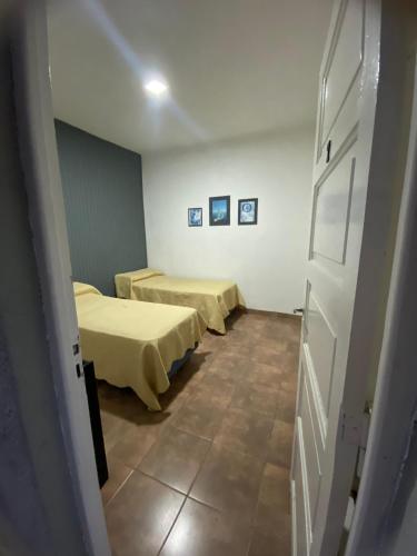 Ένα ή περισσότερα κρεβάτια σε δωμάτιο στο Hotel Báltico