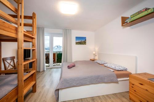 Кровать или кровати в номере Apartment AUTHORIA