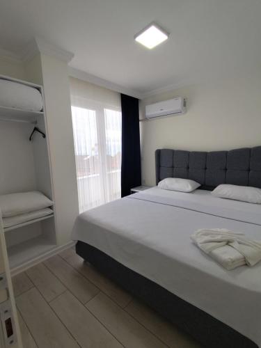 En eller flere senge i et værelse på Trabzon Life Residence