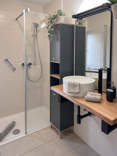 a bathroom with a sink and a shower at Allgäu Retreat in Bad Wörishofen