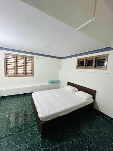 Ένα ή περισσότερα κρεβάτια σε δωμάτιο στο Pritam Homestay