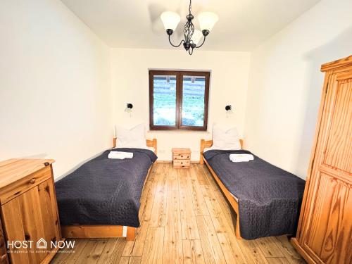 Postel nebo postele na pokoji v ubytování Alpen Panorama 2 - Lachtal Apartments