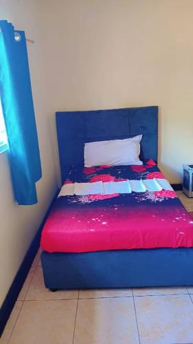 Ένα ή περισσότερα κρεβάτια σε δωμάτιο στο Villa guest house