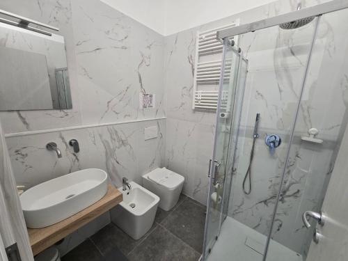 a bathroom with a shower and a sink and a toilet at Danito Rooms 5 matrimoniale in Ancona