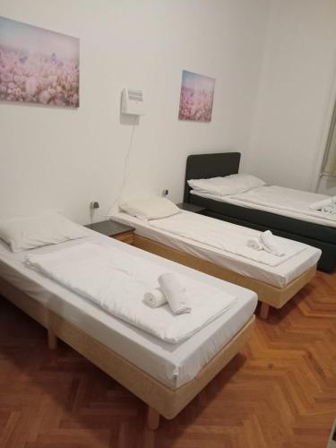 Ένα ή περισσότερα κρεβάτια σε δωμάτιο στο HM Hotel