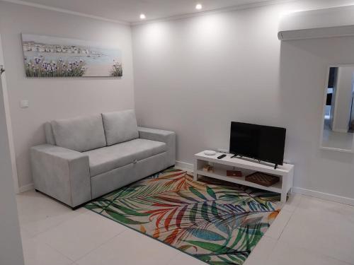 Et tv og/eller underholdning på Apartamentos do Lameirinho