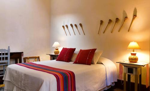 Postel nebo postele na pokoji v ubytování El Diablo y la Sandia B&B