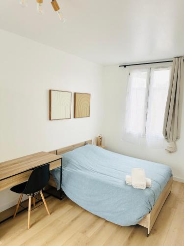 Giường trong phòng chung tại Premium T2 centre ville, 15 min futuroscope