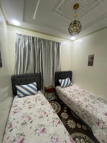 En eller flere senge i et værelse på Duplex al menzah