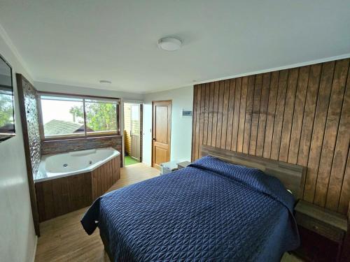 En eller flere senge i et værelse på Al Mar Cabañas