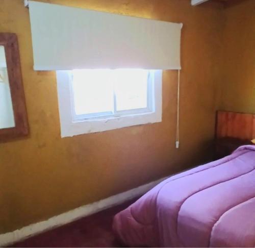 Ένα ή περισσότερα κρεβάτια σε δωμάτιο στο Hospedaje La Casona de los Paredones