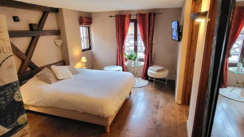 Postel nebo postele na pokoji v ubytování La Tour de la Chapelle - Parking privé