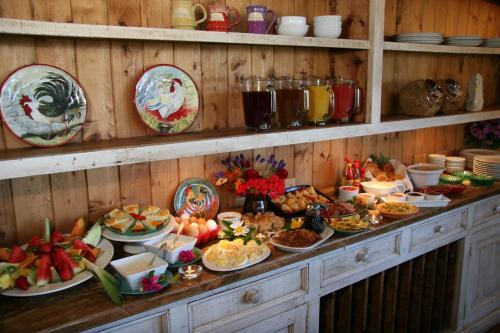 a buffet with many plates of food on a table at Elk Cove Inn & Spa in Elk